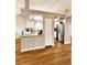 Inviting space with stainless steel appliances, granite countertops, and hardwood floors at 20308 E 48Th Dr, Denver, CO 80249