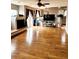 Spacious living room with hardwood floors, a fireplace, and large sliding glass doors at 20308 E 48Th Dr, Denver, CO 80249