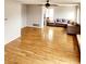 Open living room with hardwood floors, neutral walls, and lots of natural light at 20308 E 48Th Dr, Denver, CO 80249