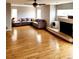 Inviting living area featuring hardwood floors, a fireplace, and lots of natural light at 20308 E 48Th Dr, Denver, CO 80249