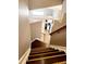Staircase with hardwood treads leading to the kitchen at 20308 E 48Th Dr, Denver, CO 80249
