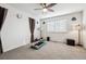 Bedroom featuring neutral carpet, ceiling fan and ample natural light at 242 S Old Hammer Ct, Aurora, CO 80018