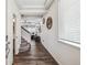 Bright entryway featuring hardwood floors, staircase, and decorative accents at 242 S Old Hammer Ct, Aurora, CO 80018