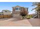 Two-story home with a stone facade, brick driveway and attached two-car garage at 242 S Old Hammer Ct, Aurora, CO 80018