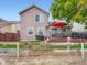 Backyard with a deck, grill, seating, and a well-manicured lawn and landscaping at 3691 Bucknell Dr, Highlands Ranch, CO 80129