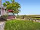 Lush backyard with a well-maintained lawn and a deck perfect for outdoor entertaining and enjoying nature at 3691 Bucknell Dr, Highlands Ranch, CO 80129