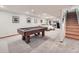 Spacious finished basement with pool table, a seating area, and ample lighting at 3691 Bucknell Dr, Highlands Ranch, CO 80129