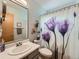 Bright bathroom featuring a stylish vanity and a shower with decorative flower curtain at 3691 Bucknell Dr, Highlands Ranch, CO 80129