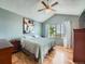 Bright bedroom with vaulted ceiling, a large window offering scenic views, and wood-look floors at 3691 Bucknell Dr, Highlands Ranch, CO 80129