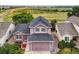 Charming two-story home with a well-manicured lawn and a spacious driveway in a peaceful neighborhood at 3691 Bucknell Dr, Highlands Ranch, CO 80129