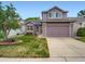Charming two-story home with a well-manicured lawn and attached garage, offers lovely curb appeal at 3691 Bucknell Dr, Highlands Ranch, CO 80129