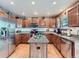 Well-equipped kitchen with stainless steel appliances, granite countertops, and light wood cabinets at 3691 Bucknell Dr, Highlands Ranch, CO 80129