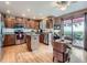 Bright kitchen with stainless steel appliances and sliding glass doors leading to outdoor patio at 3691 Bucknell Dr, Highlands Ranch, CO 80129