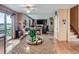 Open concept kitchen with bar seating, stainless steel appliances, and view to living area at 3691 Bucknell Dr, Highlands Ranch, CO 80129
