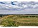 Expansive land with lush greenery and clear skies, offering endless possibilities for development or recreation at 3691 Bucknell Dr, Highlands Ranch, CO 80129