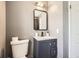 Updated bathroom with modern vanity, toilet, and stylish mirror at 4640 Fairplay Way, Denver, CO 80239
