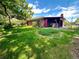 Spacious backyard with a lush lawn and mature trees, offering a private and peaceful retreat perfect for Gathering enjoyment and outdoor activities at 10425 Franklin Way, Northglenn, CO 80233
