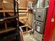 Basement showcases a new Lennox furnace, ensuring efficient heating, along with storage shelves, creating a functional and organized space at 10425 Franklin Way, Northglenn, CO 80233