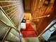 Basement stairs with carpeting lead down to a partially finished area, offering potential for storage, workshop, or creative space at 10425 Franklin Way, Northglenn, CO 80233
