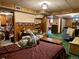 Spacious bedroom featuring wood paneling and vintage-inspired floral wallpaper at 10425 Franklin Way, Northglenn, CO 80233