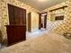 Bedroom featuring built-in closets, a dressing table, and floral wallpaper at 10425 Franklin Way, Northglenn, CO 80233