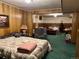 Open bedroom layout featuring wood paneling and floral wallpaper at 10425 Franklin Way, Northglenn, CO 80233
