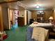 Bedroom featuring wood paneling and vintage-inspired floral wallpaper at 10425 Franklin Way, Northglenn, CO 80233