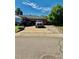 Wide driveway leading to garage of brick home, providing ample parking space and convenient access at 10425 Franklin Way, Northglenn, CO 80233