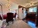 Open concept features chandelier over dining area and view of kitchen, showcasing layout and design elements at 10425 Franklin Way, Northglenn, CO 80233