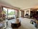 Bright living room with large window, cozy furniture, and open access to the dining area at 10425 Franklin Way, Northglenn, CO 80233