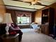 Living room with wood paneling, natural light, and comfortable seating at 10425 Franklin Way, Northglenn, CO 80233