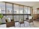 Relaxing balcony with wicker furniture, perfect for outdoor enjoyment at 3465 S Poplar St # 406, Denver, CO 80224