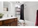 Clean bathroom with shower/tub combo and wood vanity at 3465 S Poplar St # 406, Denver, CO 80224