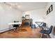 Cozy home office space with hardwood floors and a brick fireplace at 3465 S Poplar St # 406, Denver, CO 80224