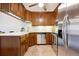 Updated kitchen with stainless steel appliances and ample cabinet space at 3465 S Poplar St # 406, Denver, CO 80224