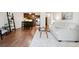 Open concept living and kitchen area with hardwood floors at 3465 S Poplar St # 406, Denver, CO 80224