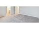 Neutral bedroom with plush carpeting, door leading to bathroom, and ample space at 19038 E 94Th Pl, Commerce City, CO 80022