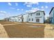 Exterior row of townhomes under construction, and sunny skies at 19038 E 94Th Pl, Commerce City, CO 80022