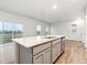 Bright kitchen with white countertops, an island sink, and stainless steel appliances at 19038 E 94Th Pl, Commerce City, CO 80022