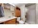 Full bathroom with tub/shower combination and wooden vanity at 7865 S Lafayette Ct, Centennial, CO 80122