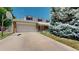Charming two-story home featuring a well-manicured front lawn and attached garage at 7865 S Lafayette Ct, Centennial, CO 80122