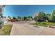 Inviting front yard with a basketball hoop, lush lawn, and a glimpse of the charming neighborhood at 7865 S Lafayette Ct, Centennial, CO 80122