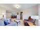 Comfortable living area with plush seating and a dining room view, creating a warm and inviting space at 7865 S Lafayette Ct, Centennial, CO 80122