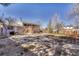 Large back yard with patio and deck, offering ample space for outdoor activities at 18056 E Mansfield Ave, Aurora, CO 80013
