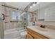 Bright bathroom with a shower-tub combination, updated fixtures, and a modern vanity at 18056 E Mansfield Ave, Aurora, CO 80013