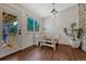 Breakfast nook features banquette seating, wood floors and access to the outdoor patio at 18056 E Mansfield Ave, Aurora, CO 80013