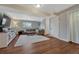 Spacious living room with a cozy seating area, modern entertainment center, and plenty of room for furniture at 18056 E Mansfield Ave, Aurora, CO 80013