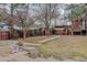 Spacious backyard featuring a brick patio and lush green lawn for outdoor enjoyment at 1585 S Holly St # 109, Denver, CO 80222