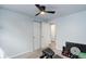 Bedroom area with exercise equipment, neutral carpet, and closet space at 1585 S Holly St # 109, Denver, CO 80222