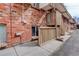 Brick exterior featuring stairs and an entrance to a unit at 1585 S Holly St # 109, Denver, CO 80222